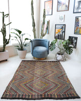 Vintage kilim rug in living room setting, old rug, antique rug, pastel colors, faded colors, Turkish rug, vintage rug, soft rug, Portland, Oregon, rug store, rug shop, local shop, earthy tones, earthy colors, warm colors