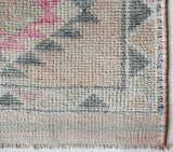 Vintage Turkish runner rug in living room setting, old rug, antique rug, pastel colors, faded colors, Turkish rug, vintage rug, soft rug, Portland, Oregon, rug store, rug shop, local shop