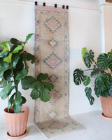 Vintage Turkish runner rug in living room setting, old rug, antique rug, pastel colors, faded colors, Turkish rug, vintage rug, soft rug, Portland, Oregon, rug store, rug shop, local shop