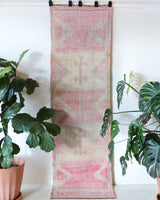 Vintage Turkish runner rug in living room setting, old rug, antique rug, pastel colors, faded colors, Turkish rug, vintage rug, soft rug, Portland, Oregon, rug store, rug shop, local shop