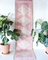 Vintage Turkish runner rug in living room setting, old rug, antique rug, pastel colors, faded colors, Turkish rug, vintage rug, soft rug, Portland, Oregon, rug store, rug shop, local shop