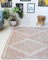Vintage kilim rug in living room setting, old rug, antique rug, pastel colors, faded colors, Turkish rug, vintage rug, soft rug, Portland, Oregon, rug store, rug shop, local shop, earthy tones, earthy colors, warm colors
