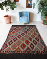 Vintage kilim rug in living room setting, bright colors, wild shaman, soft rug, bold color, Portland, Oregon, rug store, rug shop, local shop, vintage rug, modern kilim, warm colors