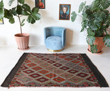 Vintage kilim rug in living room setting, bright colors, wild shaman, soft rug, bold color, Portland, Oregon, rug store, rug shop, local shop, vintage rug, modern kilim, warm colors