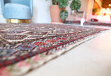 Vintage kilim rug in living room setting, old rug, antique rug, pastel colors, faded colors, Turkish rug, vintage rug, soft rug, Portland, Oregon, rug store, rug shop, local shop, earthy tones, earthy colors, warm colors