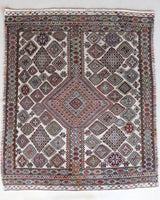 Vintage kilim rug in living room setting, old rug, antique rug, pastel colors, faded colors, Turkish rug, vintage rug, soft rug, Portland, Oregon, rug store, rug shop, local shop, earthy tones, earthy colors, warm colors