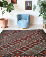 Vintage kilim rug in living room setting, bright colors, wild shaman, soft rug, bold color, Portland, Oregon, rug store, rug shop, local shop, vintage rug, modern kilim, warm colors