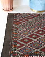 Vintage kilim rug in living room setting, bright colors, wild shaman, soft rug, bold color, Portland, Oregon, rug store, rug shop, local shop, vintage rug, modern kilim, warm colors