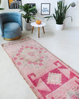 Vintage Turkish runner rug in living room setting, old rug, antique rug, pastel colors, faded colors, Turkish rug, vintage rug, soft rug, Portland, Oregon, rug store, rug shop, local shop