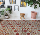 Vintage kilim rug in room decor setting, old rug, antique rug, pastel colors, faded colors, Turkish rug, vintage rug, soft rug, Portland, Oregon, rug store, rug shop, local shop, bold colors, bright colors, faded colors