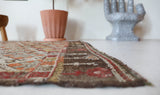 Vintage kilim rug in room decor setting, old rug, antique rug, pastel colors, faded colors, Turkish rug, vintage rug, soft rug, Portland, Oregon, rug store, rug shop, local shop, bold colors, bright colors, faded colors