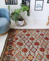 Vintage kilim rug in room decor setting, old rug, antique rug, pastel colors, faded colors, Turkish rug, vintage rug, soft rug, Portland, Oregon, rug store, rug shop, local shop, bold colors, bright colors, faded colors