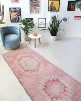 Vintage Turkish runner rug in living room setting, old rug, antique rug, pastel colors, faded colors, Turkish rug, vintage rug, soft rug, Portland, Oregon, rug store, rug shop, local shop