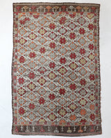 Vintage kilim rug in room decor setting, old rug, antique rug, pastel colors, faded colors, Turkish rug, vintage rug, soft rug, Portland, Oregon, rug store, rug shop, local shop, bold colors, bright colors, faded colors