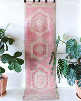 Vintage Turkish runner rug in living room setting, old rug, antique rug, pastel colors, faded colors, Turkish rug, vintage rug, soft rug, Portland, Oregon, rug store, rug shop, local shop