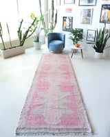 Vintage Turkish runner rug in living room setting, old rug, antique rug, pastel colors, faded colors, Turkish rug, vintage rug, soft rug, Portland, Oregon, rug store, rug shop, local shop
