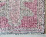 Vintage Turkish runner rug in living room setting, old rug, antique rug, pastel colors, faded colors, Turkish rug, vintage rug, soft rug, Portland, Oregon, rug store, rug shop, local shop