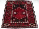 Vintage Turkish rug in a living room setting, pile rug, Turkish rug, vintage rug, portland, rug shop, bright colors, wild shaman, soft rug, bold color, Portland, Oregon, rug store, rug shop, local shop, antique rug