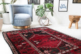 Vintage Turkish rug in a living room setting, pile rug, Turkish rug, vintage rug, portland, rug shop, bright colors, wild shaman, soft rug, bold color, Portland, Oregon, rug store, rug shop, local shop, antique rug