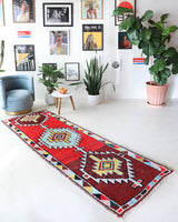 Vintage Turkish runner rug in living room setting, old rug, antique rug, pastel colors, faded colors, Turkish rug, vintage rug, soft rug, Portland, Oregon, rug store, rug shop, local shop