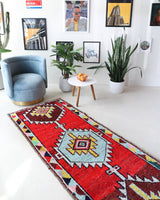 Vintage Turkish runner rug in living room setting, old rug, antique rug, pastel colors, faded colors, Turkish rug, vintage rug, soft rug, Portland, Oregon, rug store, rug shop, local shop