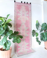 Vintage Turkish runner rug in living room setting, old rug, antique rug, pastel colors, faded colors, Turkish rug, vintage rug, soft rug, Portland, Oregon, rug store, rug shop, local shop