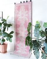 Vintage Turkish runner rug in living room setting, old rug, antique rug, pastel colors, faded colors, Turkish rug, vintage rug, soft rug, Portland, Oregon, rug store, rug shop, local shop