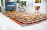 Vintage Turkish rug in a living room setting, pile rug, Turkish rug, vintage rug, portland, rug shop, bright colors, wild shaman, soft rug, bold color, Portland, Oregon, rug store, rug shop, local shop, antique rug