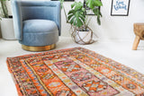 Vintage Turkish rug in a living room setting, pile rug, Turkish rug, vintage rug, portland, rug shop, bright colors, wild shaman, soft rug, bold color, Portland, Oregon, rug store, rug shop, local shop, antique rug
