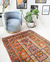 Vintage Turkish rug in a living room setting, pile rug, Turkish rug, vintage rug, portland, rug shop, bright colors, wild shaman, soft rug, bold color, Portland, Oregon, rug store, rug shop, local shop, antique rug