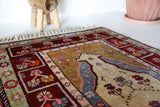 Vintage Turkish rug in a living room setting, pile rug, Turkish rug, vintage rug, portland, rug shop, bright colors, wild shaman, soft rug, bold color, Portland, Oregon, rug store, rug shop, local shop, antique rug