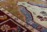 Vintage Turkish rug in a living room setting, pile rug, Turkish rug, vintage rug, portland, rug shop, bright colors, wild shaman, soft rug, bold color, Portland, Oregon, rug store, rug shop, local shop, antique rug