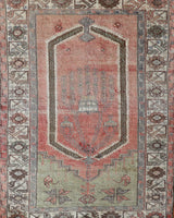 Vintage Turkish rug in living room setting, old rug, antique rug, pastel colors, faded colors, Turkish rug, vintage rug, soft rug, Portland, Oregon, rug store, rug shop, local shop