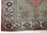 Vintage Turkish rug in living room setting, old rug, antique rug, pastel colors, faded colors, Turkish rug, vintage rug, soft rug, Portland, Oregon, rug store, rug shop, local shop