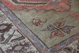 Vintage Turkish rug in living room setting, old rug, antique rug, pastel colors, faded colors, Turkish rug, vintage rug, soft rug, Portland, Oregon, rug store, rug shop, local shop