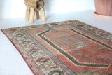 Vintage Turkish rug in living room setting, old rug, antique rug, pastel colors, faded colors, Turkish rug, vintage rug, soft rug, Portland, Oregon, rug store, rug shop, local shop