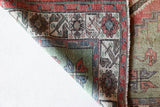 Vintage Turkish rug in living room setting, old rug, antique rug, pastel colors, faded colors, Turkish rug, vintage rug, soft rug, Portland, Oregon, rug store, rug shop, local shop