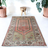 Vintage Turkish rug in living room setting, old rug, antique rug, pastel colors, faded colors, Turkish rug, vintage rug, soft rug, Portland, Oregon, rug store, rug shop, local shop