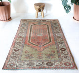 Vintage Turkish rug in living room setting, old rug, antique rug, pastel colors, faded colors, Turkish rug, vintage rug, soft rug, Portland, Oregon, rug store, rug shop, local shop