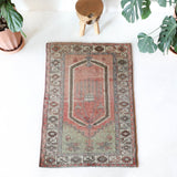 Vintage Turkish rug in living room setting, old rug, antique rug, pastel colors, faded colors, Turkish rug, vintage rug, soft rug, Portland, Oregon, rug store, rug shop, local shop