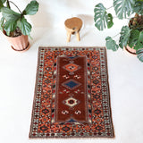 Vintage Turkish rug in a living room setting, pile rug, Turkish rug, vintage rug, portland, rug shop, bright colors, wild shaman, soft rug, bold color, Portland, Oregon, rug store, rug shop, local shop, antique rug