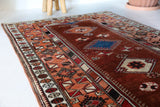 Vintage Turkish rug in a living room setting, pile rug, Turkish rug, vintage rug, portland, rug shop, bright colors, wild shaman, soft rug, bold color, Portland, Oregon, rug store, rug shop, local shop, antique rug