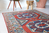 Vintage Turkish rug in living room setting, old rug, antique rug, pastel colors, faded colors, Turkish rug, vintage rug, soft rug, Portland, Oregon, rug store, rug shop, local shop