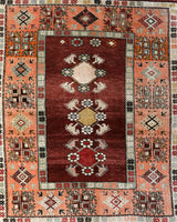 Vintage Turkish rug in a living room setting, pile rug, Turkish rug, vintage rug, portland, rug shop, bright colors, wild shaman, soft rug, bold color, Portland, Oregon, rug store, rug shop, local shop, antique rug