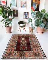 Vintage Turkish rug in a living room setting, pile rug, Turkish rug, vintage rug, portland, rug shop, bright colors, wild shaman, soft rug, bold color, Portland, Oregon, rug store, rug shop, local shop, antique rug