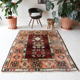 Vintage Turkish rug in a living room setting, pile rug, Turkish rug, vintage rug, portland, rug shop, bright colors, wild shaman, soft rug, bold color, Portland, Oregon, rug store, rug shop, local shop, antique rug
