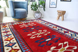 Vintage Turkish rug in a living room setting, pile rug, Turkish rug, vintage rug, portland, rug shop, bright colors, wild shaman, soft rug, bold color, Portland, Oregon, rug store, rug shop, local shop