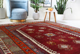 Vintage Turkish rug in a living room setting, pile rug, Turkish rug, vintage rug, portland, rug shop, bright colors, wild shaman, soft rug, bold color, Portland, Oregon, rug store, rug shop, local shop