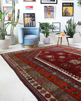 Vintage Turkish rug in a living room setting, pile rug, Turkish rug, vintage rug, portland, rug shop, bright colors, wild shaman, soft rug, bold color, Portland, Oregon, rug store, rug shop, local shop