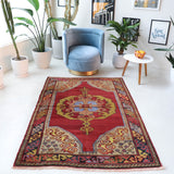 Vintage Turkish rug in a living room setting, pile rug, Turkish rug, vintage rug, portland, rug shop, bright colors, wild shaman, soft rug, bold color, Portland, Oregon, rug store, rug shop, local shop, antique rug